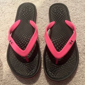 Under Armour flip flops.